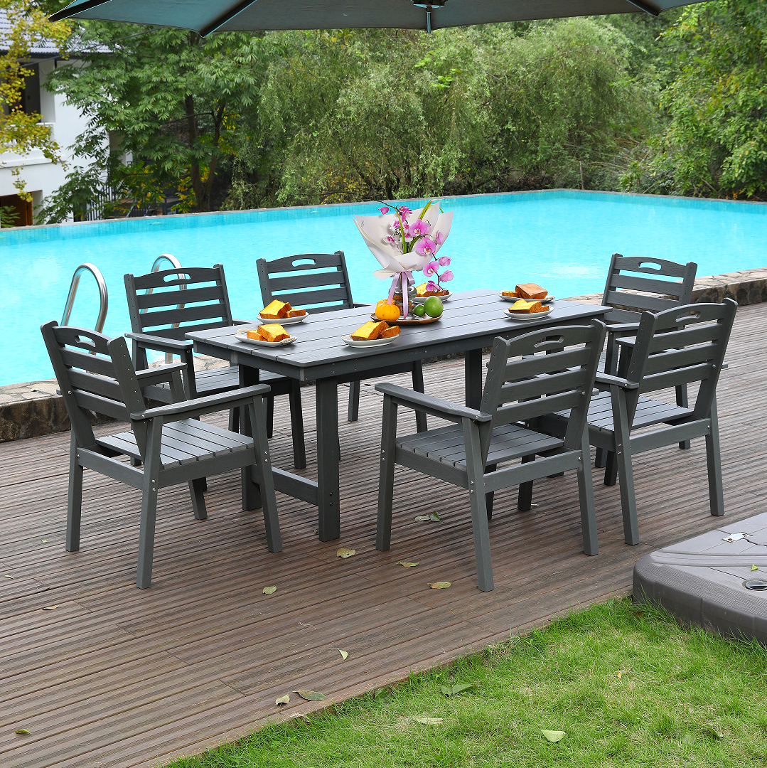 HDPE outdoor dining set by HouseOfZazla with table and six dark gray chairs by pool on Tampa Home & Garden Store