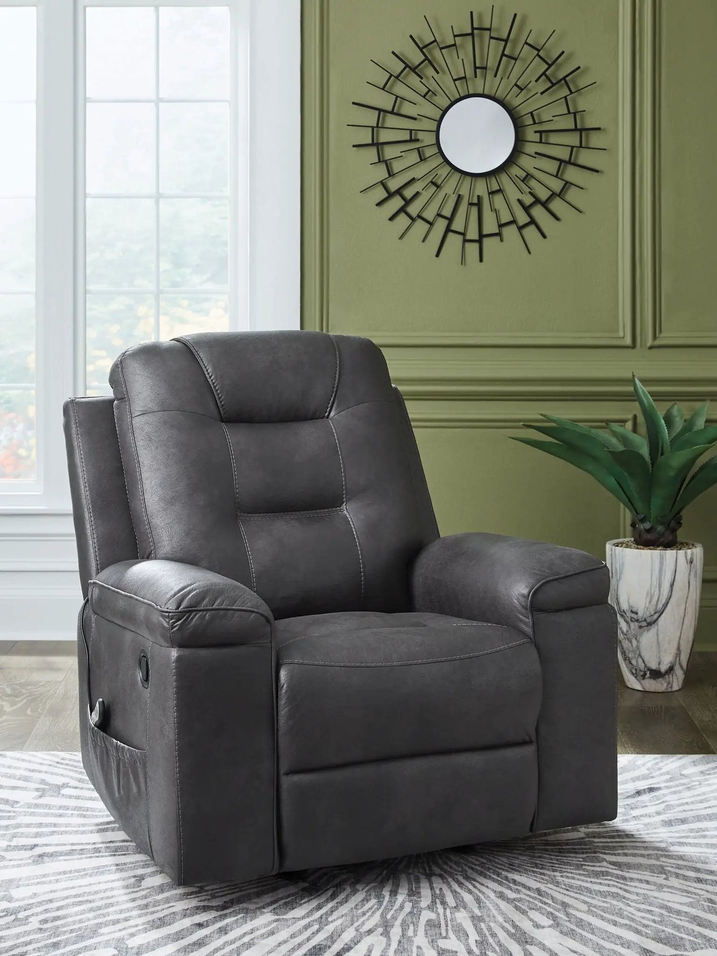 Stockworth Rocker Recliner in dark gray faux leather with padded arms and stitching on Tampa Home & Garden Store