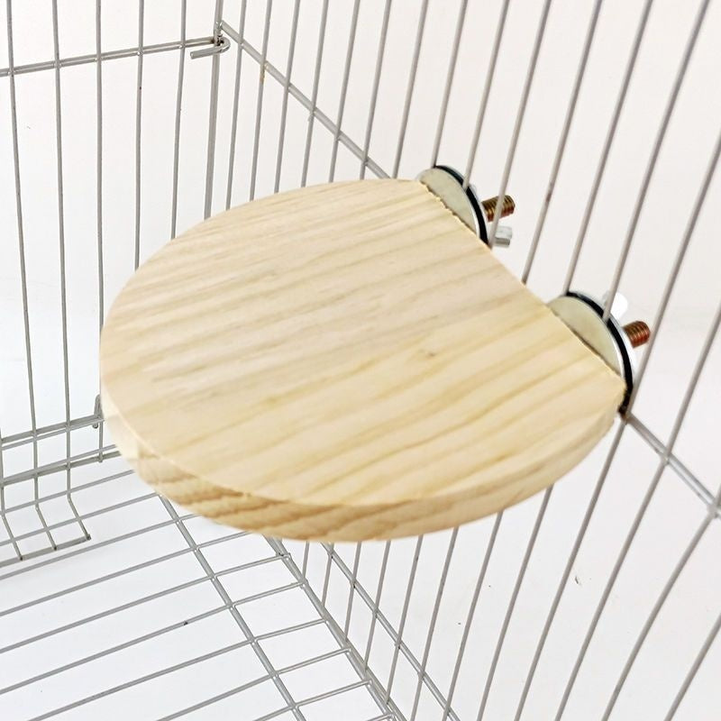 Solid wood round bird cage jumping platform with natural finish mounted to cage bars on Tampa Home & Garden Store