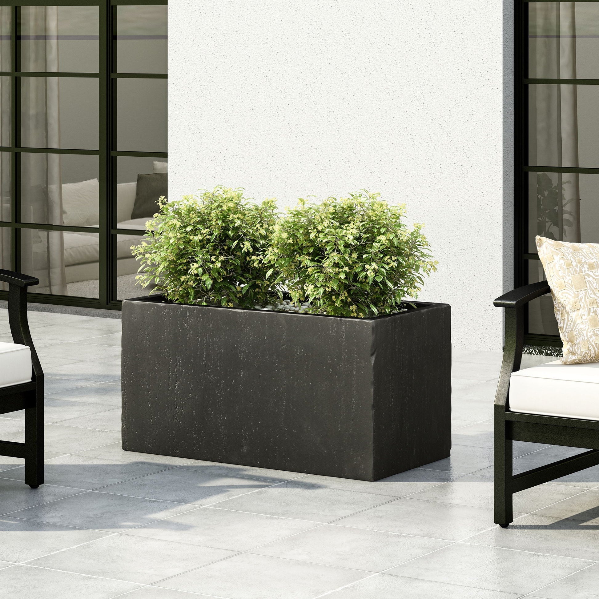 Modern Outdoor Planter, black rectangular pot with green shrub on a patio on Tampa Home & Garden Store
