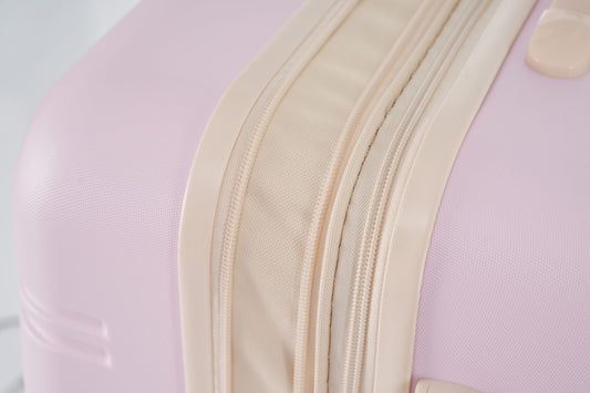 3 piece hardside spinner luggage close-up showing beige zipper tracks on pink shell on Tampa Home & Garden Store