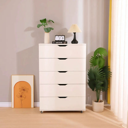 Modern white 5-drawer dresser on wheels with curved pulls, styled with plants and a lamp on Tampa Home & Garden Store