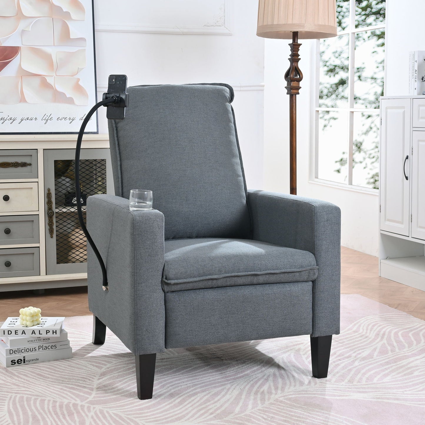 Gray fabric reclining chair with mounted phone holder in a living room setting on Tampa Home & Garden Store