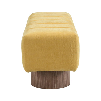 Upholstered dining bench in golden yellow striped fabric on a dark wood pedestal base on Tampa Home & Garden Store