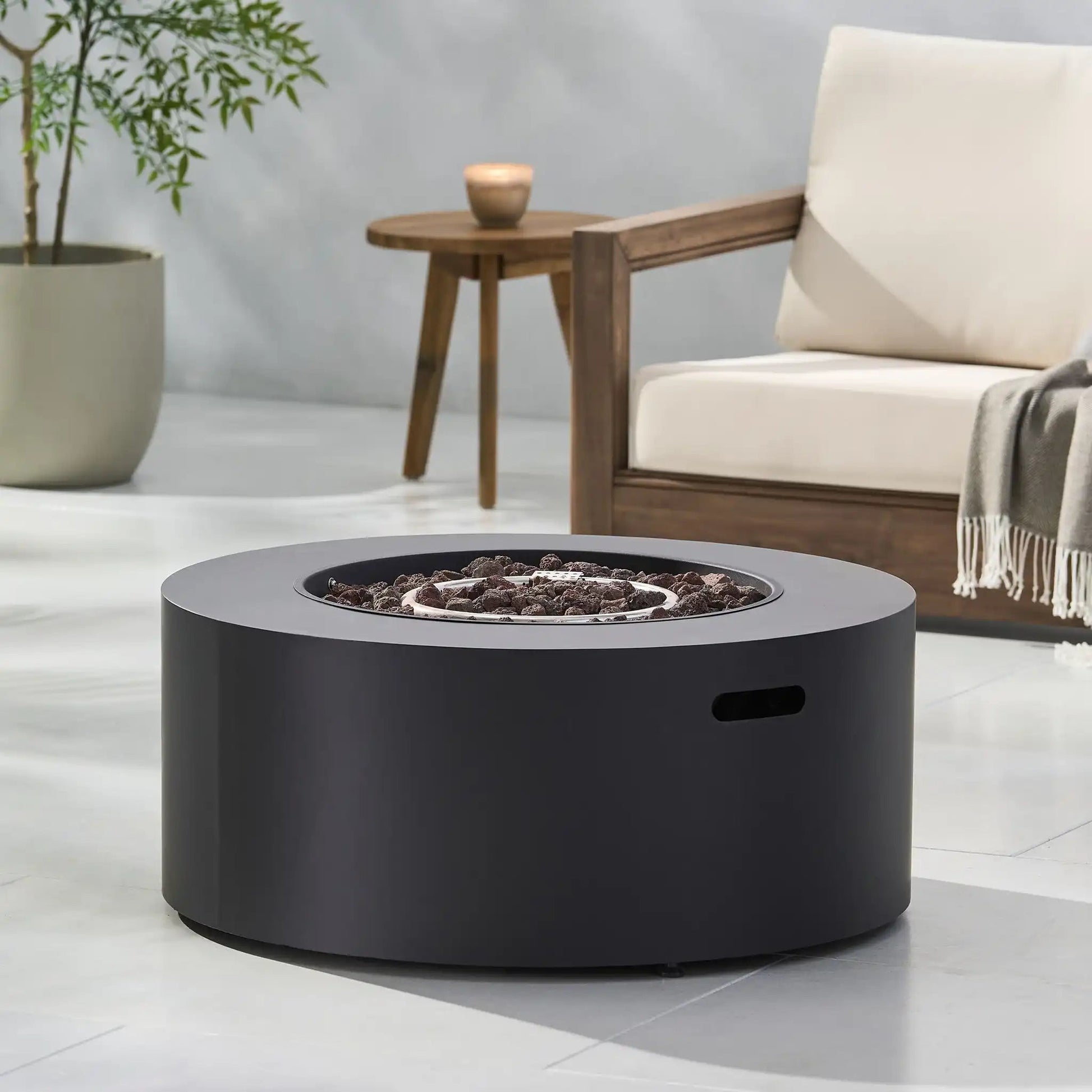 Round iron fire pit in black with lava rocks, 40,000 BTU, HouseOfZazla on Tampa Home & Garden Store