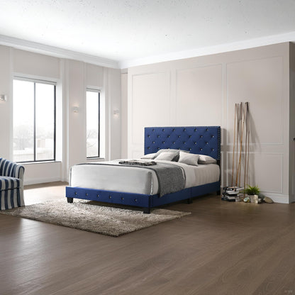 Luxurious Upholstered Bed with blue tufted headboard and gray bedding in a paneled room on Tampa Home & Garden Store