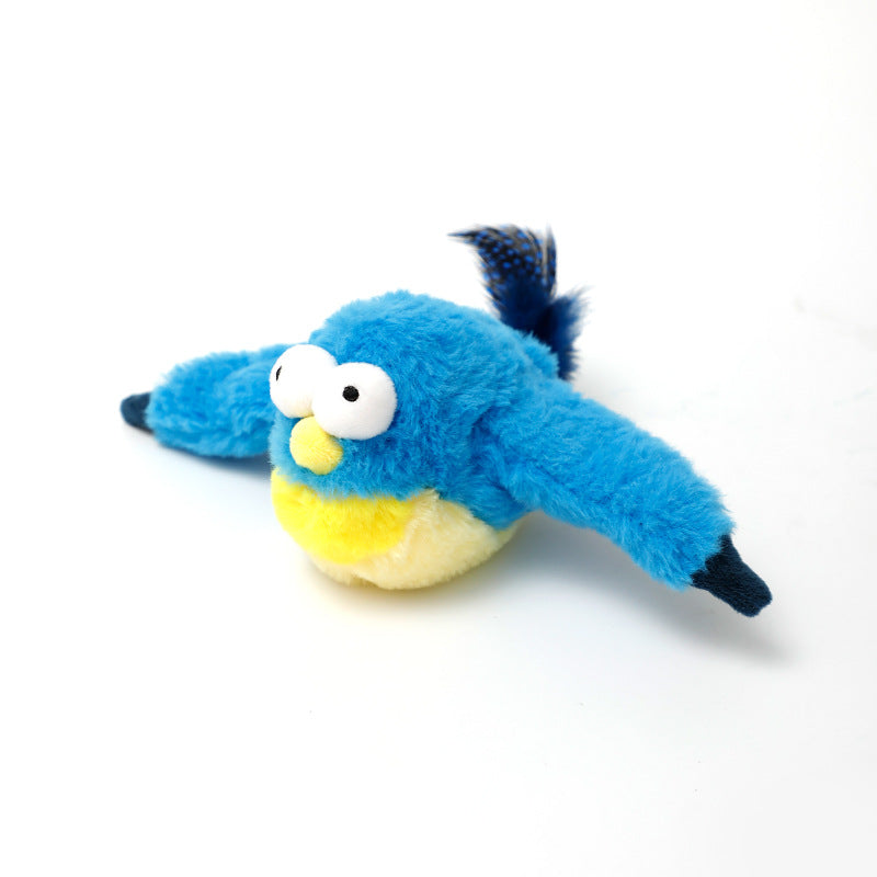 Blue plush bird toy with yellow belly, white eyes and a dark tail feather on Tampa Home & Garden Store