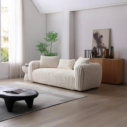 Cancun white ribbed sofa by Unique Piece Furniture in a bright living room with a console on Tampa Home & Garden Store