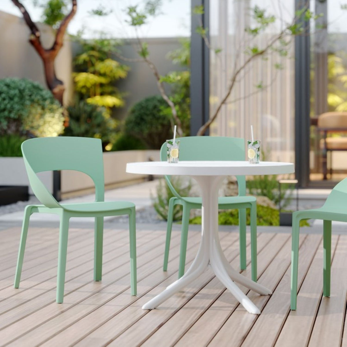 Modern 4 Piece Outdoor Set with mint-green stain-resistant chairs and white round table on Tampa Home & Garden Store