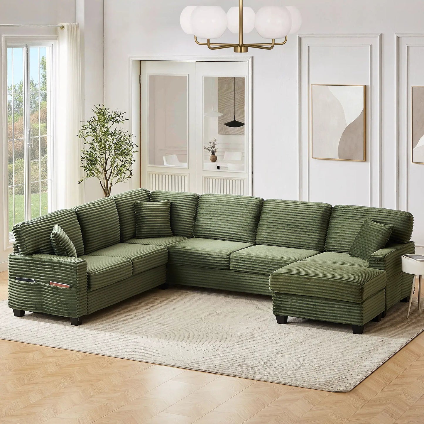 Upholstered U-shaped green corduroy sectional with movable ottoman and storage pockets on Tampa Home & Garden Store