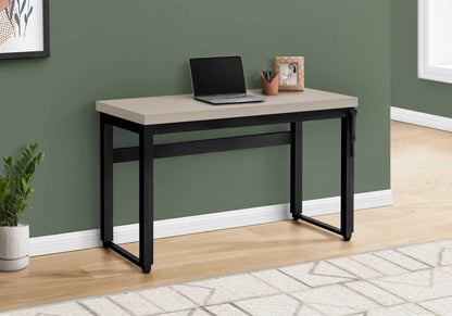 Computer desk with beige top and black metal frame, laptop, pencil cup, and photo frame on Tampa Home & Garden Store