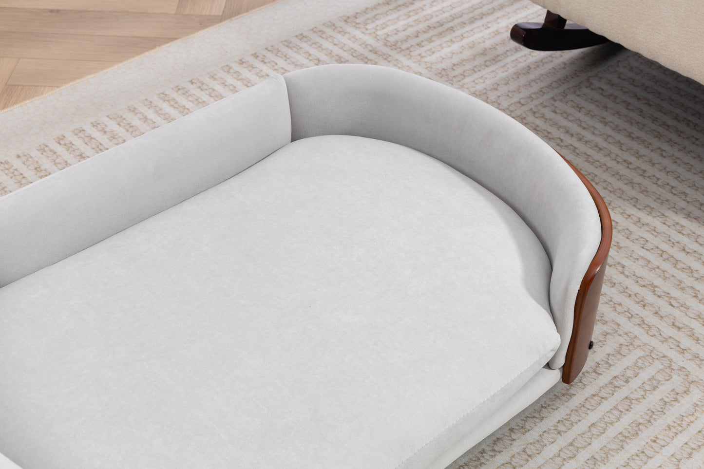 Scandinavian style elevated dog bed with gray upholstery, curved wood frame, pet sofa on Tampa Home & Garden Store