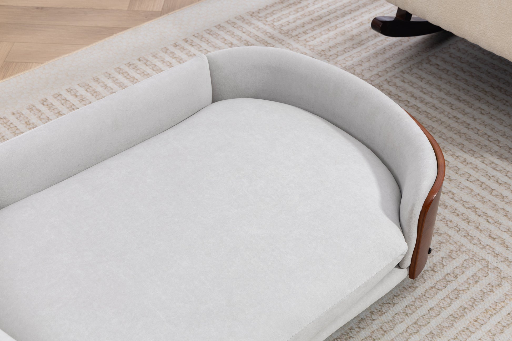 Scandinavian style elevated dog bed with gray upholstery, curved wood frame, pet sofa on Tampa Home & Garden Store