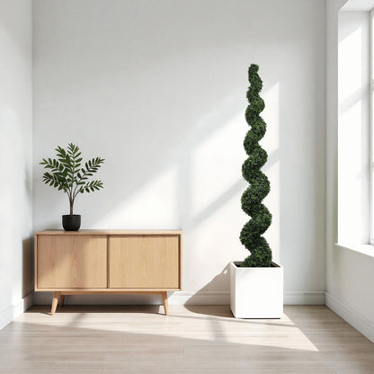 Faux plants duo: small potted plant on a wooden cabinet beside a spiral topiary in a white planter on Tampa Home & Garden Store