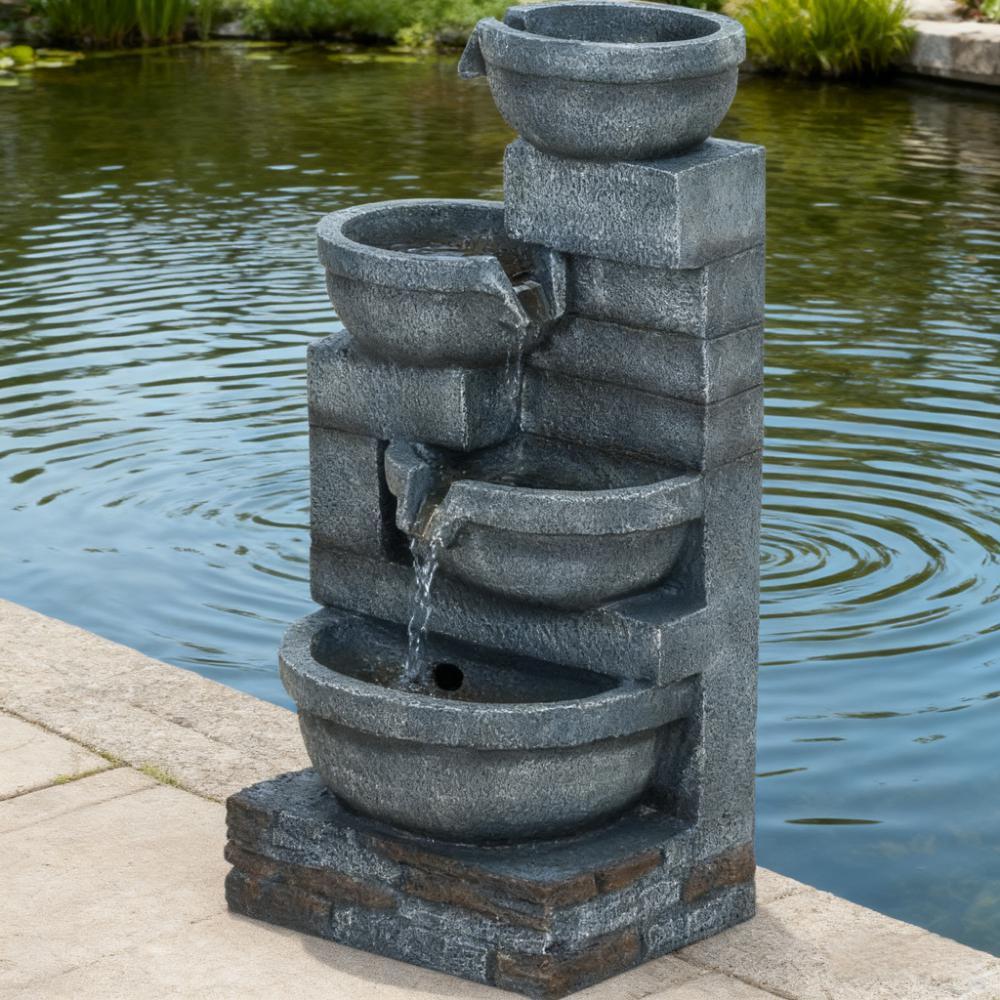 Garden Fountain outdoor waterfall with gray stacked-stone bowls and cascading water by a pond on Tampa Home & Garden Store