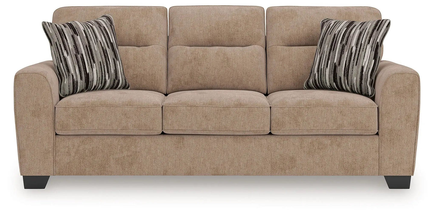 Olten sofa beige stationary sofa with three cushions and striped pillows on Tampa Home & Garden Store