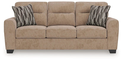 Olten sofa beige stationary sofa with three cushions and striped pillows on Tampa Home & Garden Store