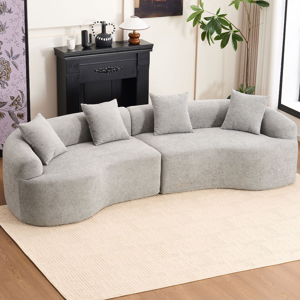 Grey fabric 4-seat sectional sofa with plush cushions in living room setting on Tampa Home & Garden Store