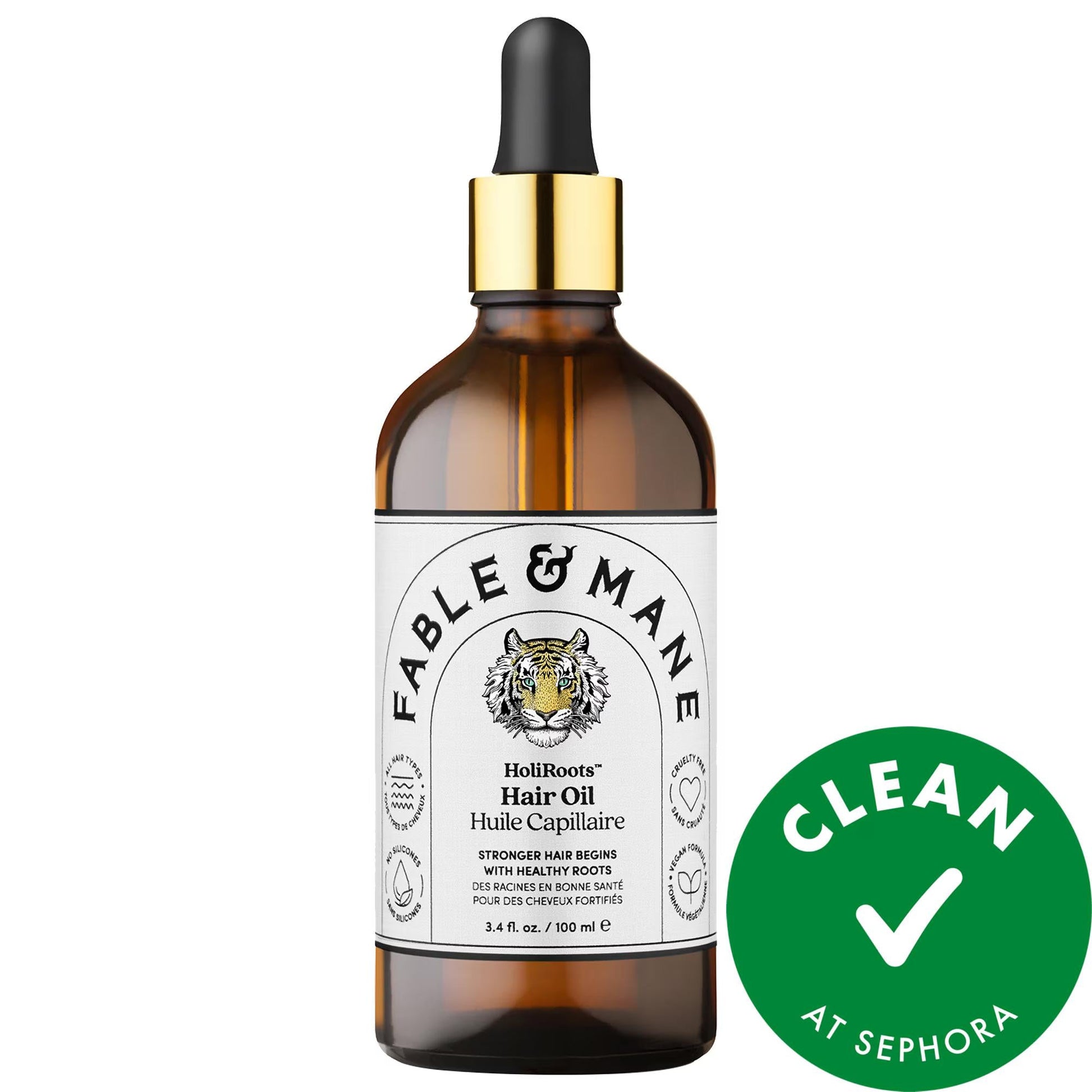 HoliRoots Hair Oil bottle with amber glass, black dropper cap and tiger logo label on Tampa Home & Garden Store