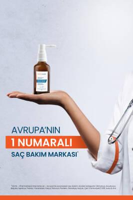 Ducray Neoptide hair strengthening serum bottle on palm with Turkish hair care banner on Tampa Home & Garden Store