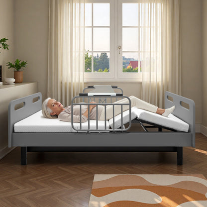 Electric adjustable hospital bed for home use with gray steel frame and rails patient resting on Tampa Home & Garden Store