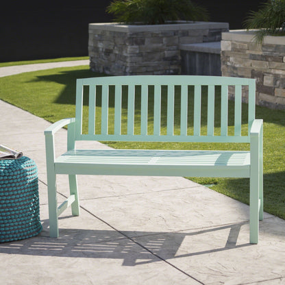 Mint green wooden Loja outdoor bench with slatted back on a stone planter backdrop on Tampa Home & Garden Store
