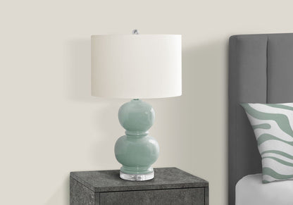 Table lamp ceramic blue with a glossy teal base and white fabric shade on gray nightstand on Tampa Home & Garden Store