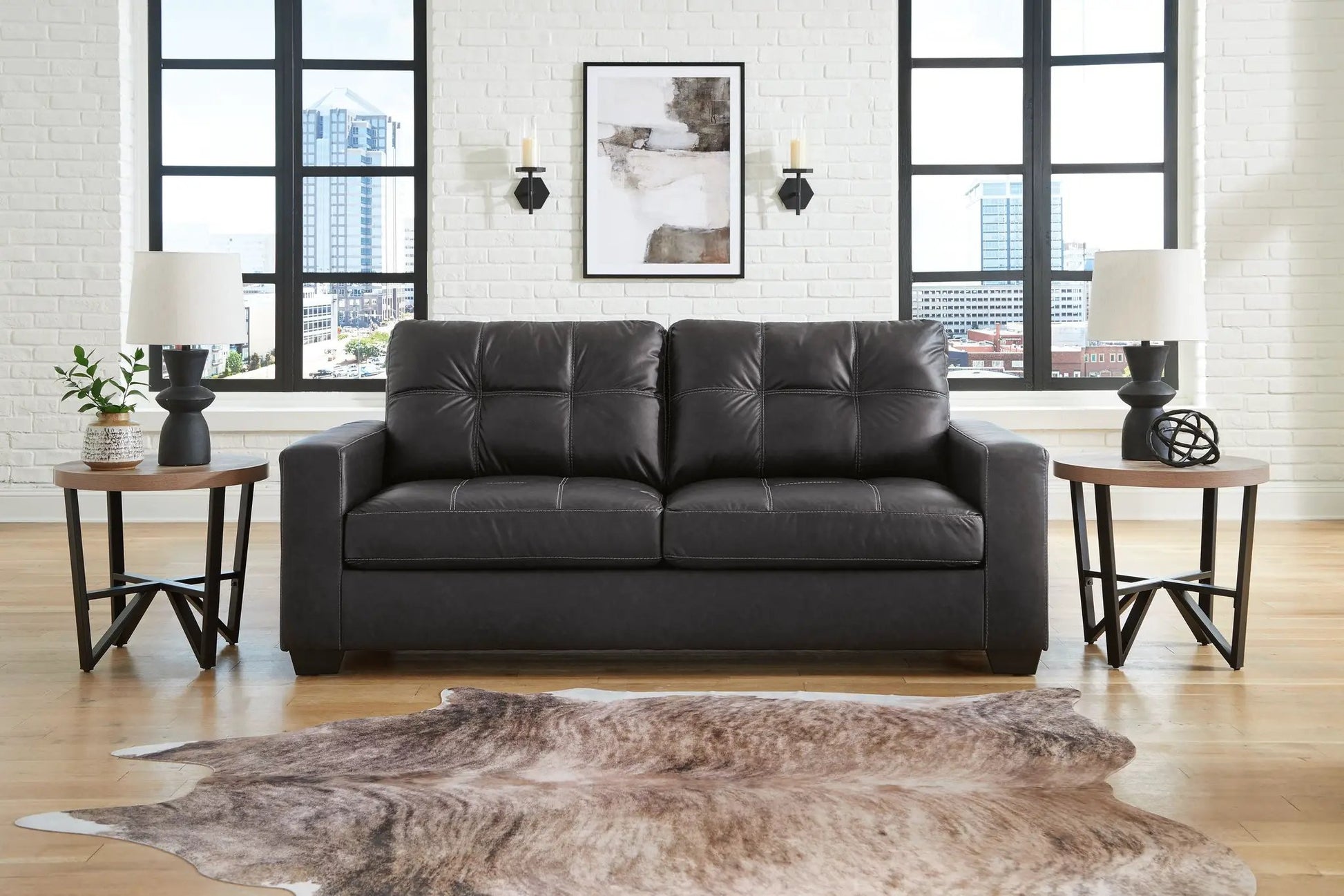 Barlin Mills Sofa by Unique Piece Furniture, black leather stationary sofa in a living room on Tampa Home & Garden Store