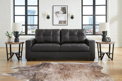 Barlin Mills Sofa by Unique Piece Furniture, black leather stationary sofa in a living room on Tampa Home & Garden Store