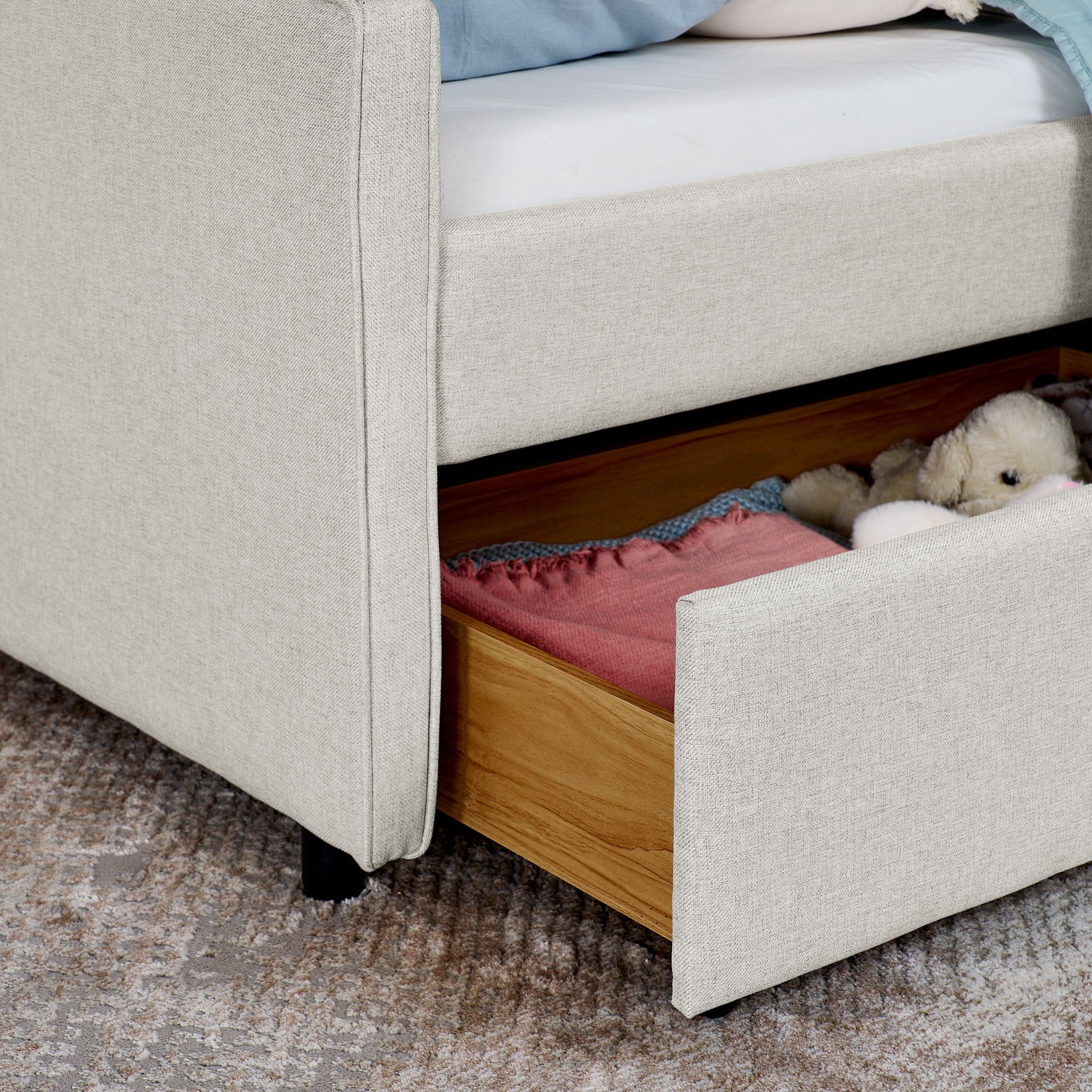 Twin upholstered beige sofa bed with underbed storage drawers on Tampa Home & Garden Store