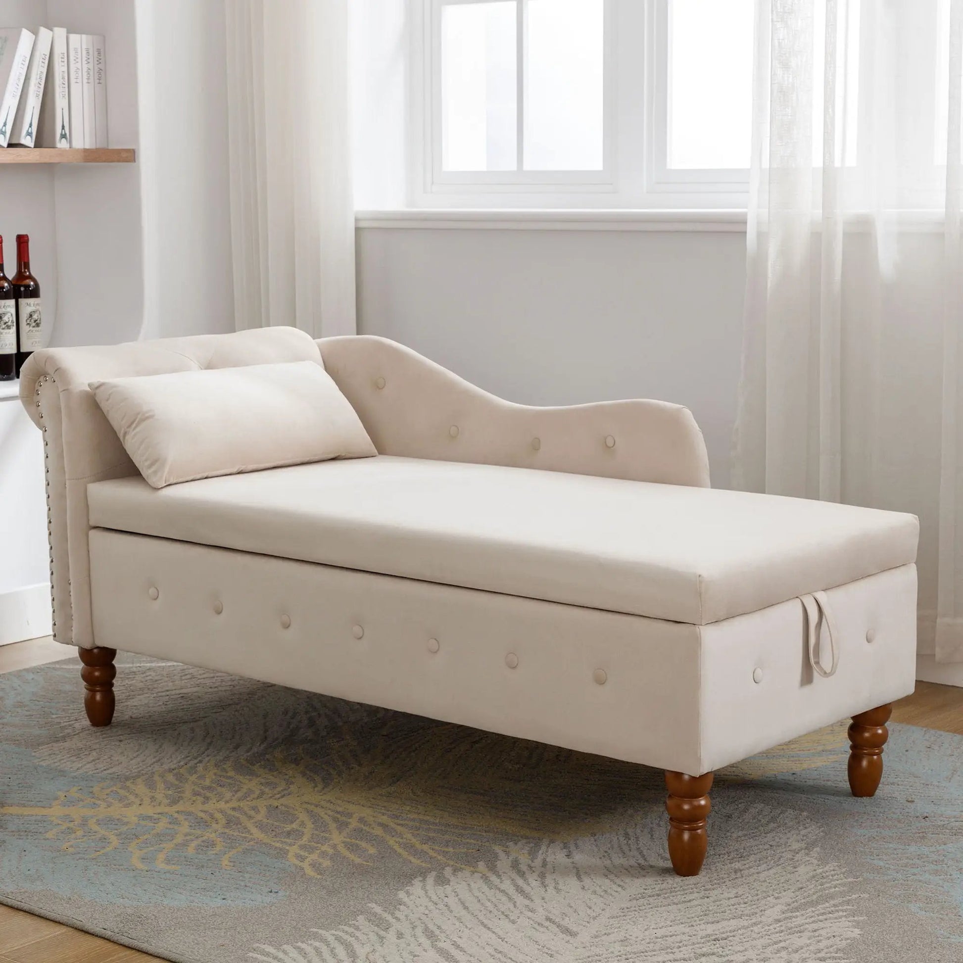 Beige upholstered chaise lounge with rolled arms, nailhead trim, storage base, and pillow on Tampa Home & Garden Store