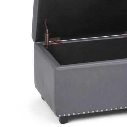 Hamilton Upholstered Storage Ottoman in dark grey fabric with copper hardware and nailhead trim on Tampa Home & Garden Store