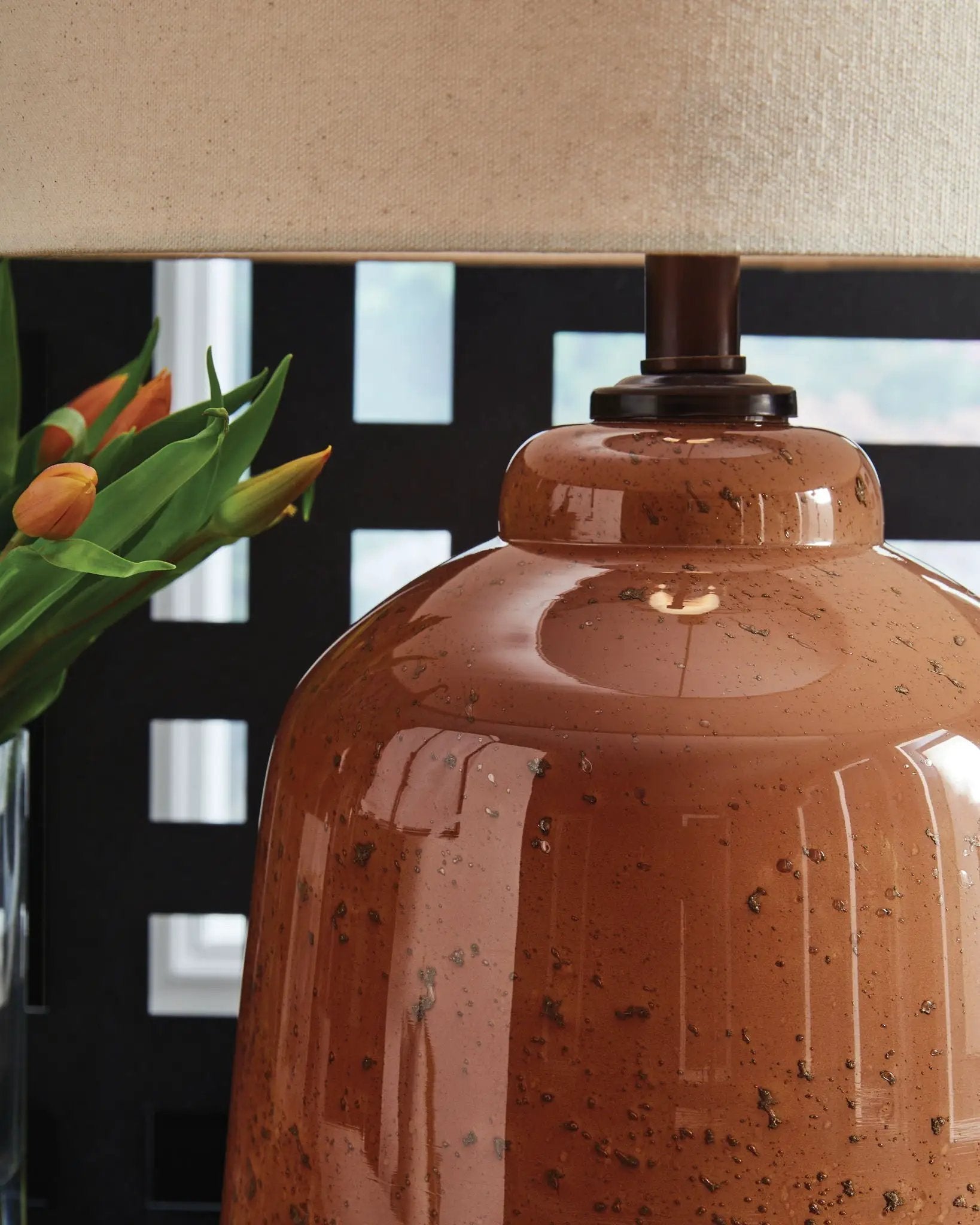 Aaleahya rust glass table lamp with beige linen shade tulips nearby on Tampa Home & Garden Store