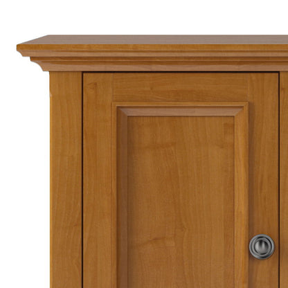 Handcrafted wide TV stand with paneled doors, round metal knob, warm wood finish, ample storage on Tampa Home & Garden Store