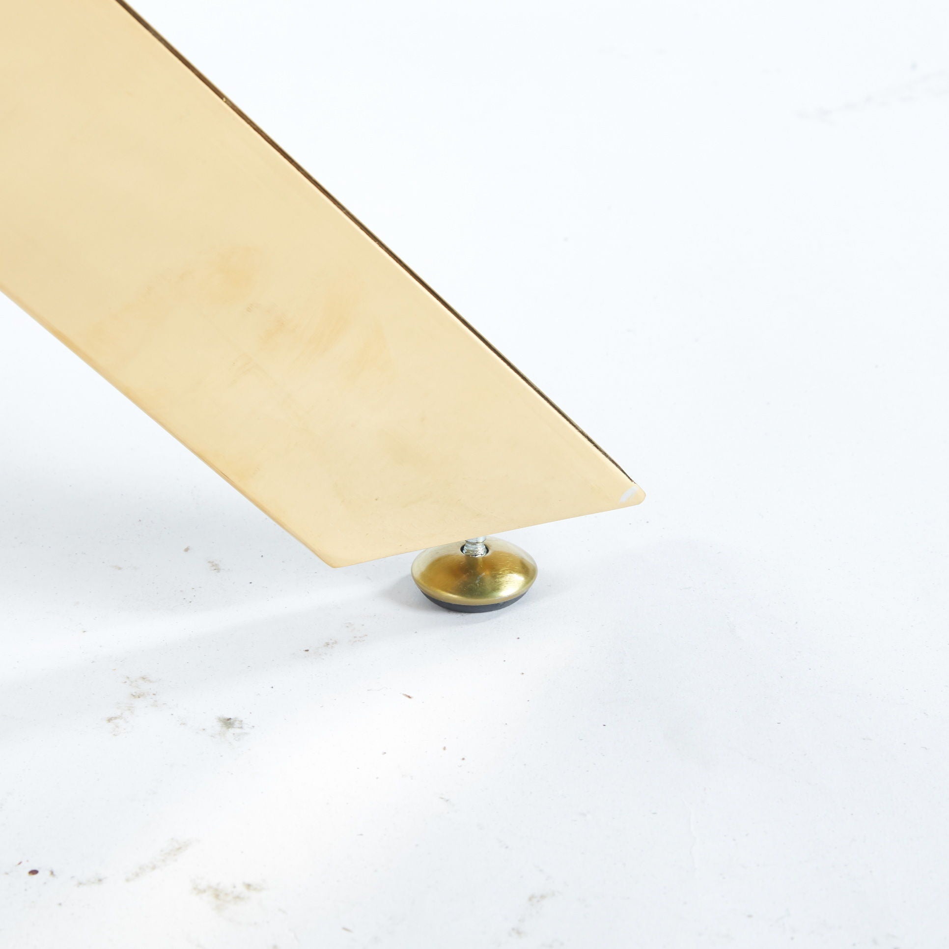 Gold metal dining table base with cross leg design and round brass foot on Tampa Home & Garden Store
