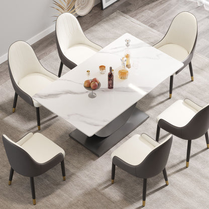 Dining table with white marble artificial stone top and crescent-shaped dark metal legs on Tampa Home & Garden Store