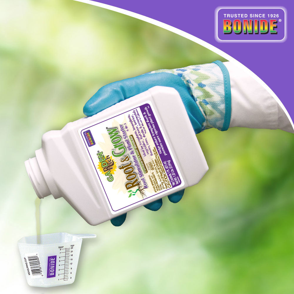Bonide Root & Grow Concentrate fertilizer bottle poured into measuring cup in a gloved hand on Tampa Home & Garden Store