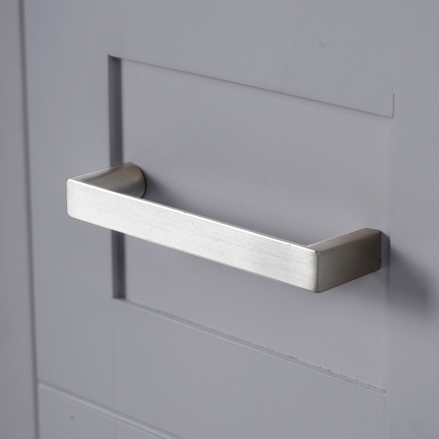Modern bathroom vanity drawer front in light gray with brushed metal handle by HouseOfZazla on Tampa Home & Garden Store