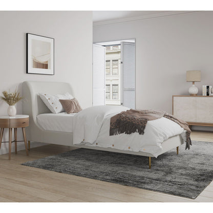 Mid-Century Modern upholstered bed with curved headboard in light cream fabric, white bedding and warm wood legs on Tampa Home & Garden Store