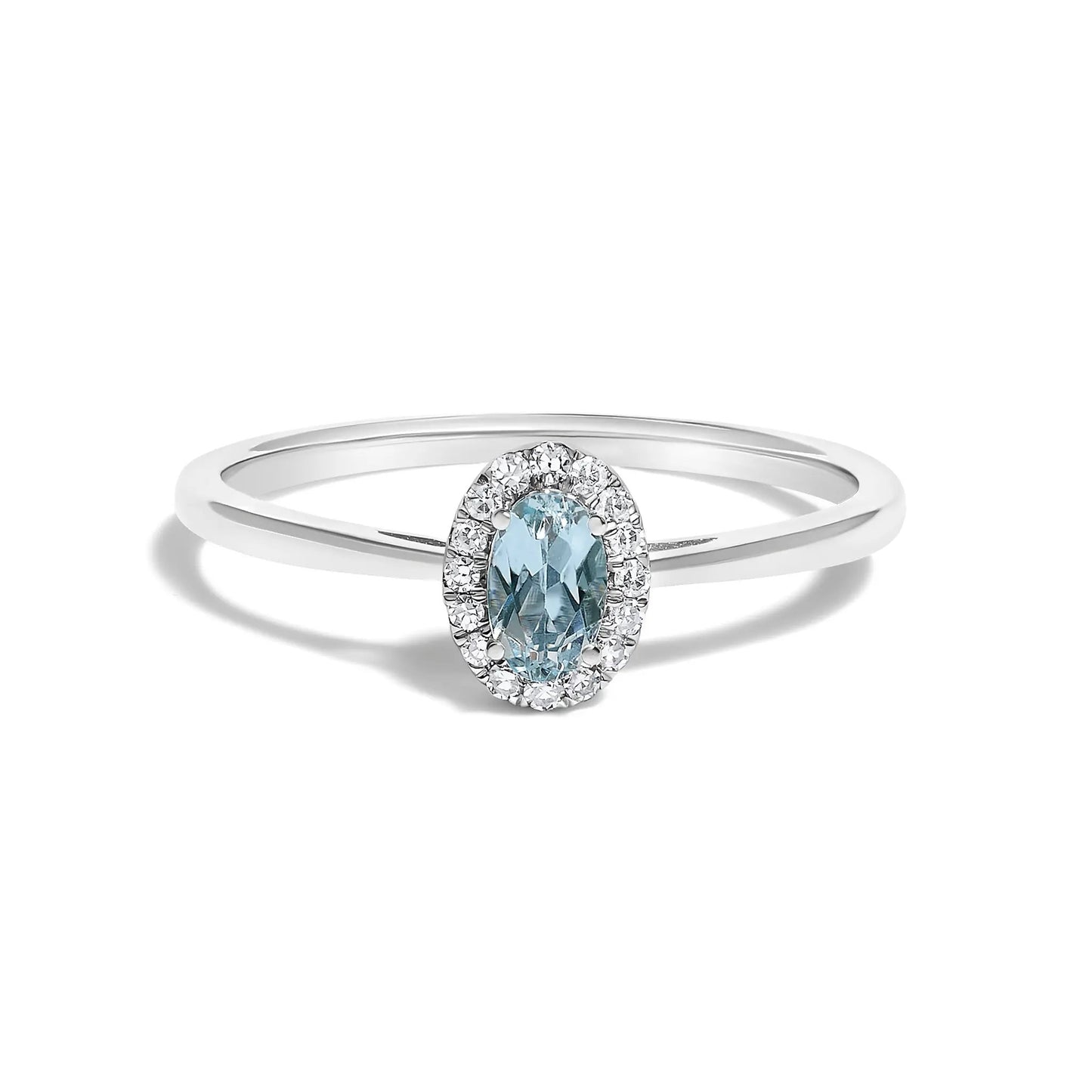 Ring with oval blue gemstone surrounded by a diamond halo on a white gold band on Tampa Home & Garden Store