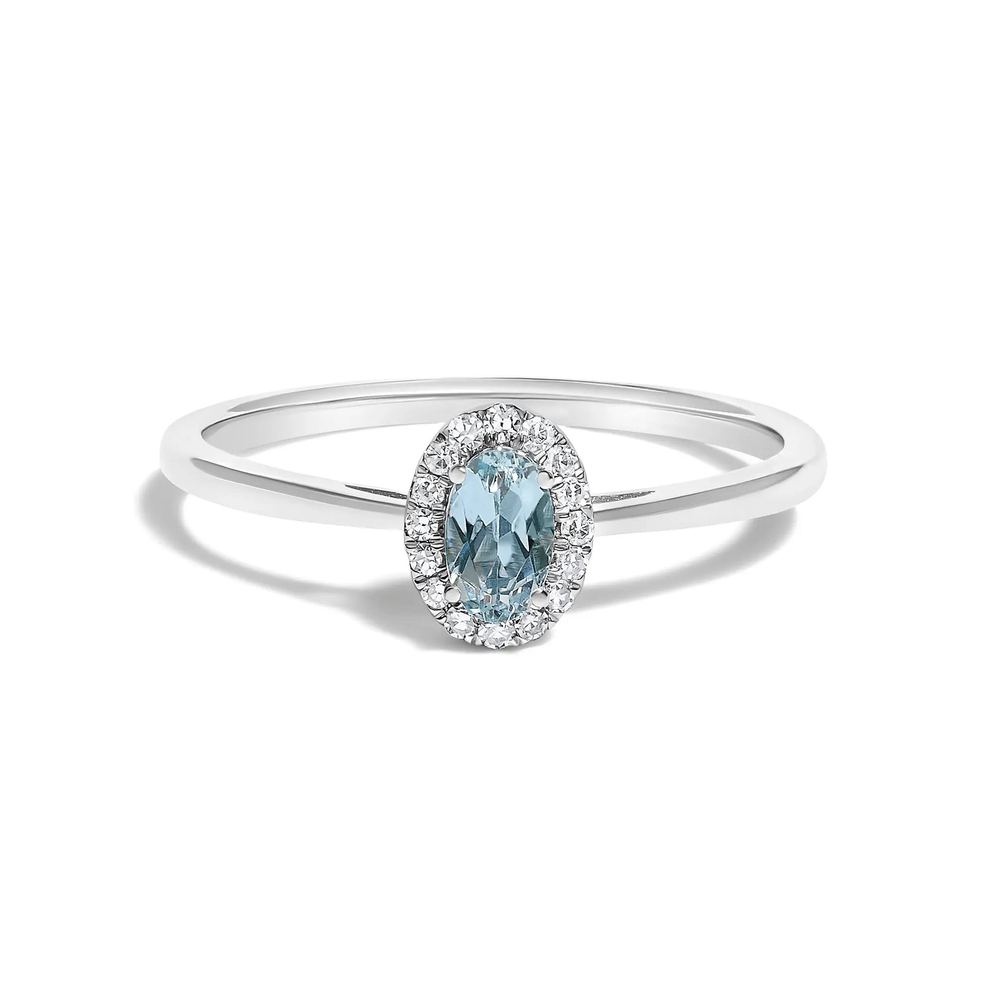 Ring with oval blue gemstone surrounded by a diamond halo on a white gold band on Tampa Home & Garden Store