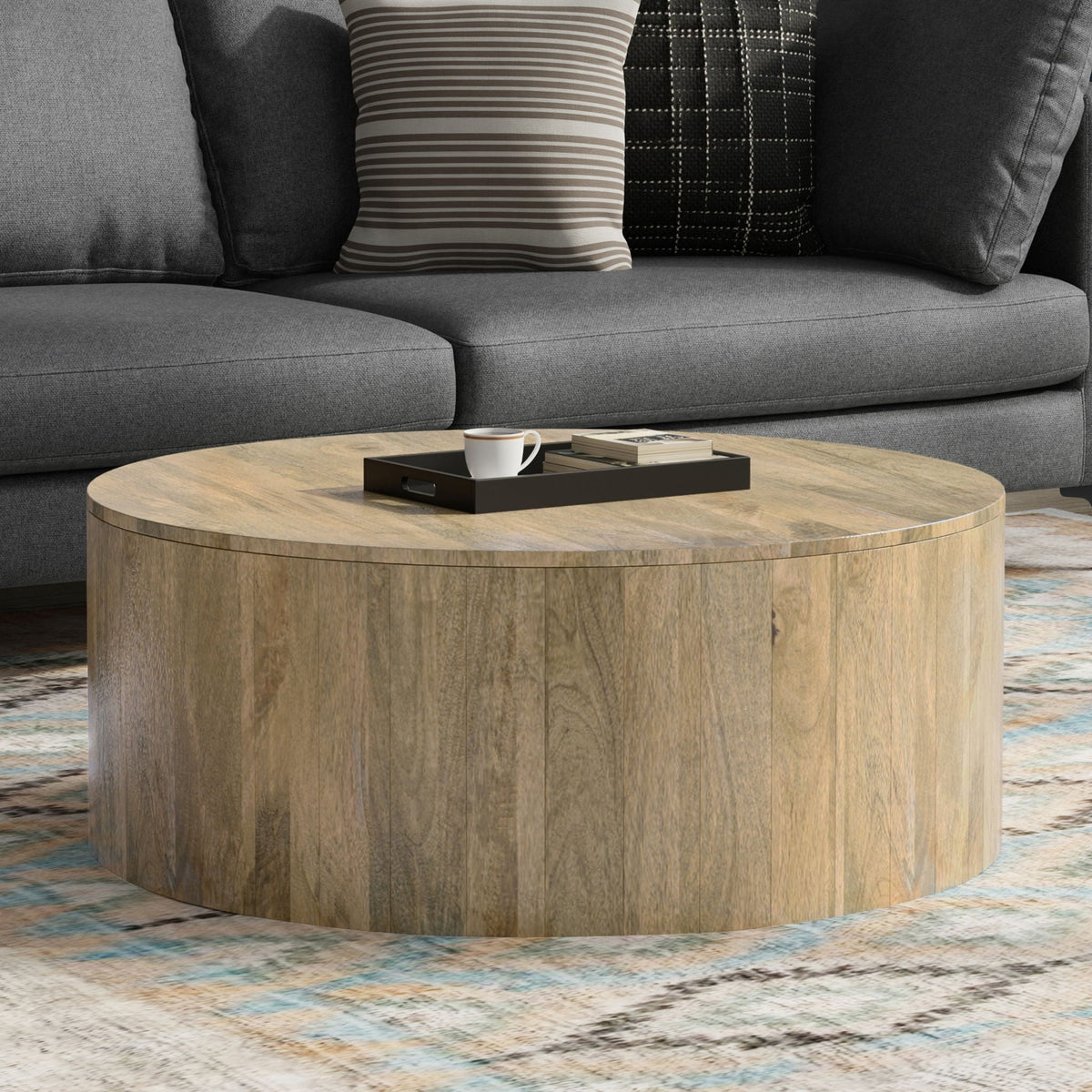 Millbury Drum Coffee Table, round natural wood drum base with black tray and white mug on top on Tampa Home & Garden Store