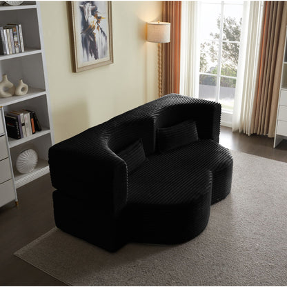 Floor convertible sleeper futon sofa in black ribbed upholstery with 2 pillows in living room on Tampa Home & Garden Store