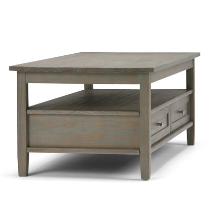 Warm Shaker handcrafted coffee table in graywashed wood with open lower shelf and drawers on Tampa Home & Garden Store