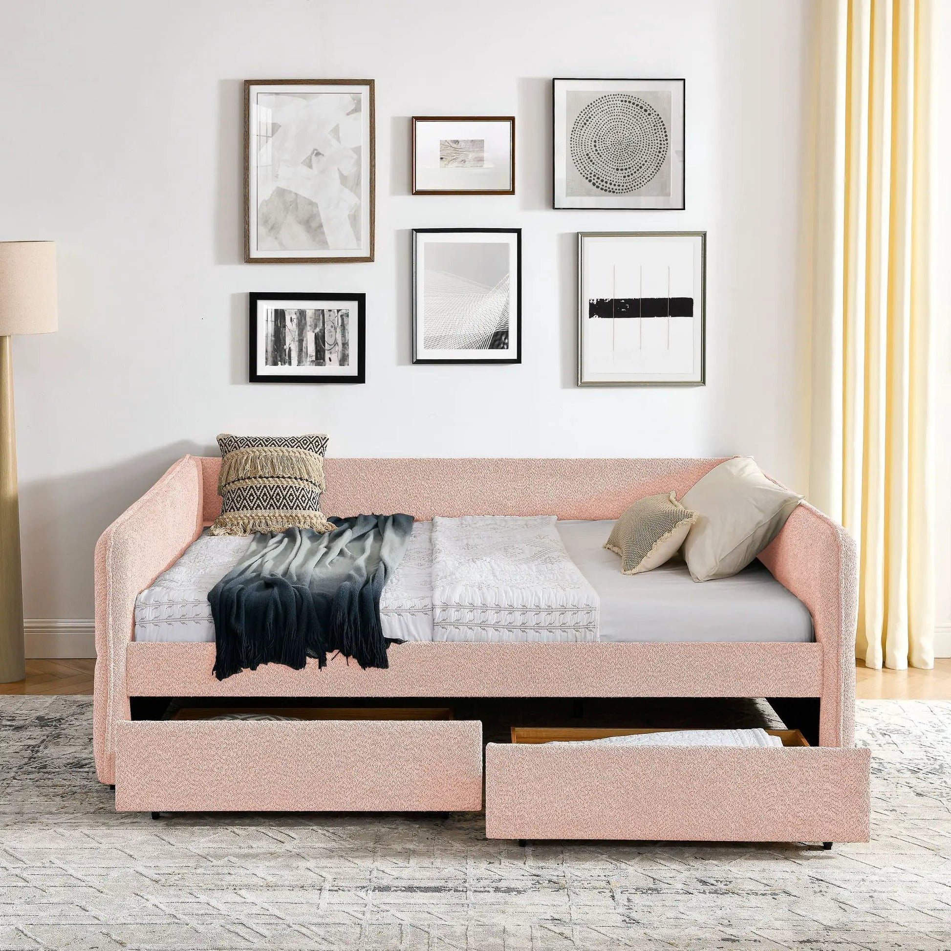 Upholstered pink daybed with two drawers in textured fabric, bedding and wall art on Tampa Home & Garden Store