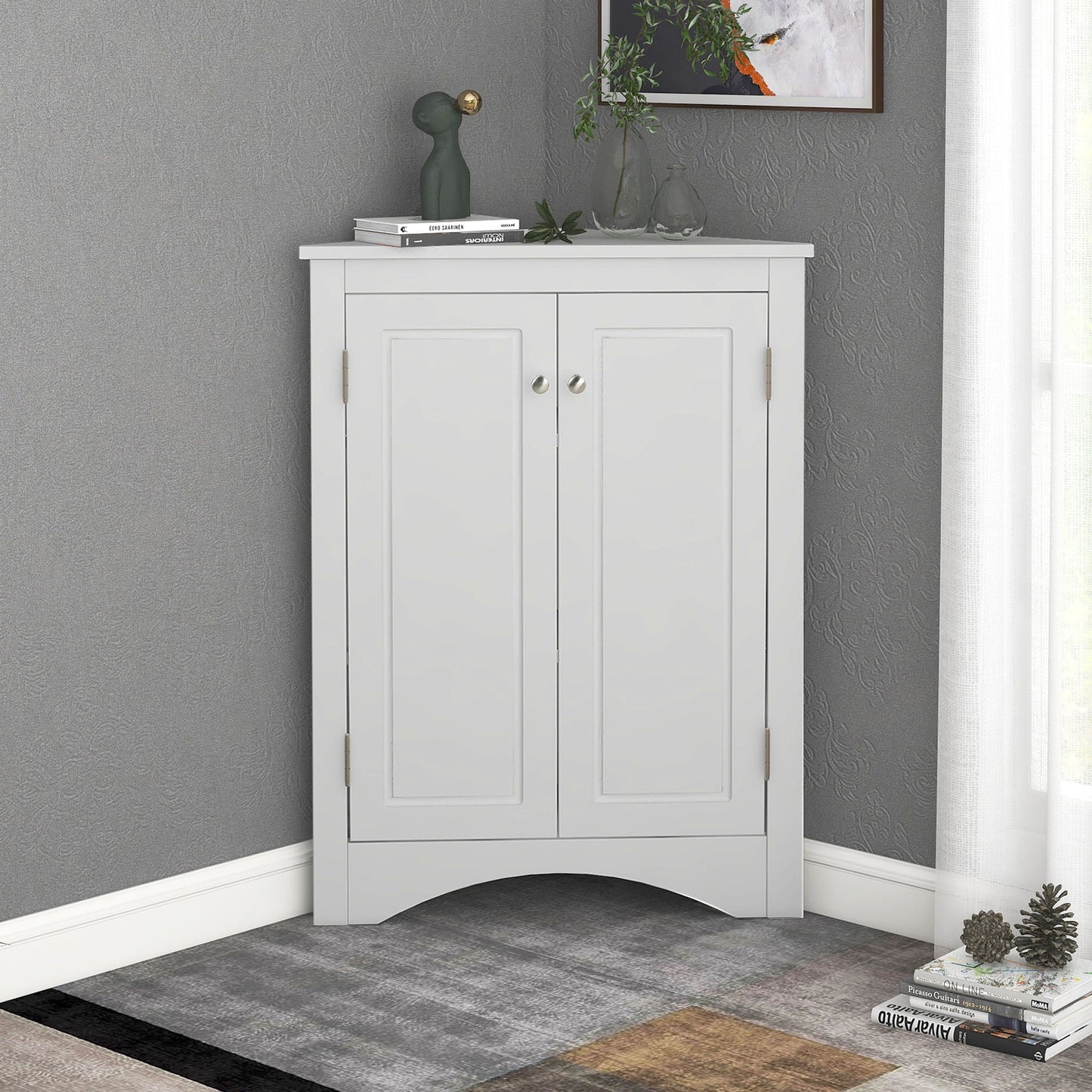 White freestanding linen cabinet with two doors and metal knobs on Tampa Home & Garden Store