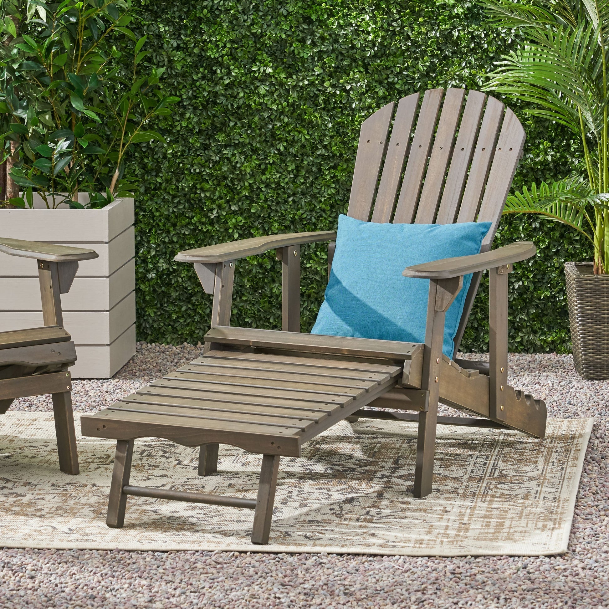 Malibu Adirondack chair in weathered gray wood with blue cushion for outdoor living on Tampa Home & Garden Store