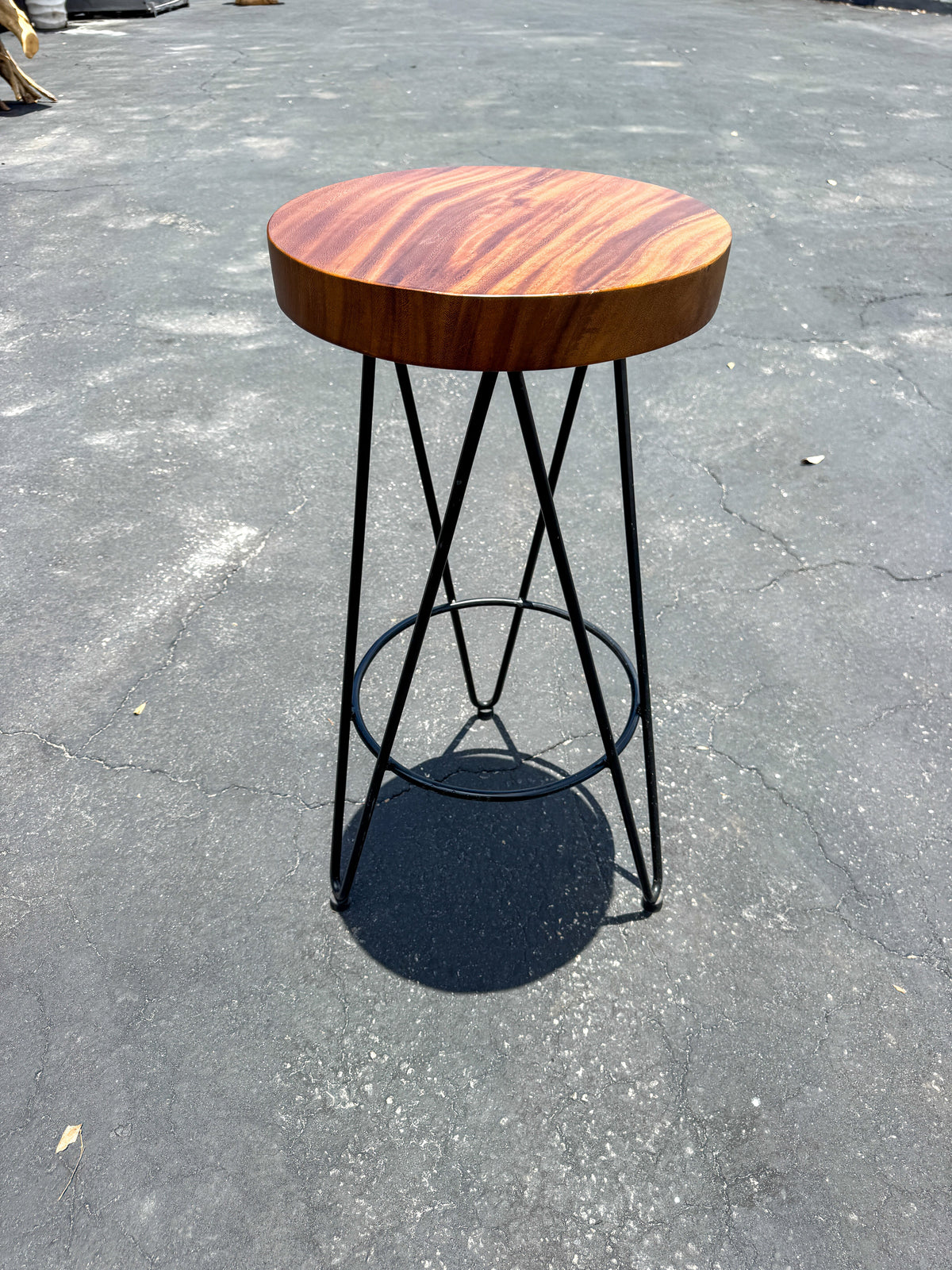 Iron-frame bar stool with round teak seat and black metal legs on Tampa Home & Garden Store