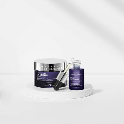 Esthederm Intensive Retinol Cream jar beside blue Retinol Oil Serum bottle on pedestal on Tampa Home & Garden Store