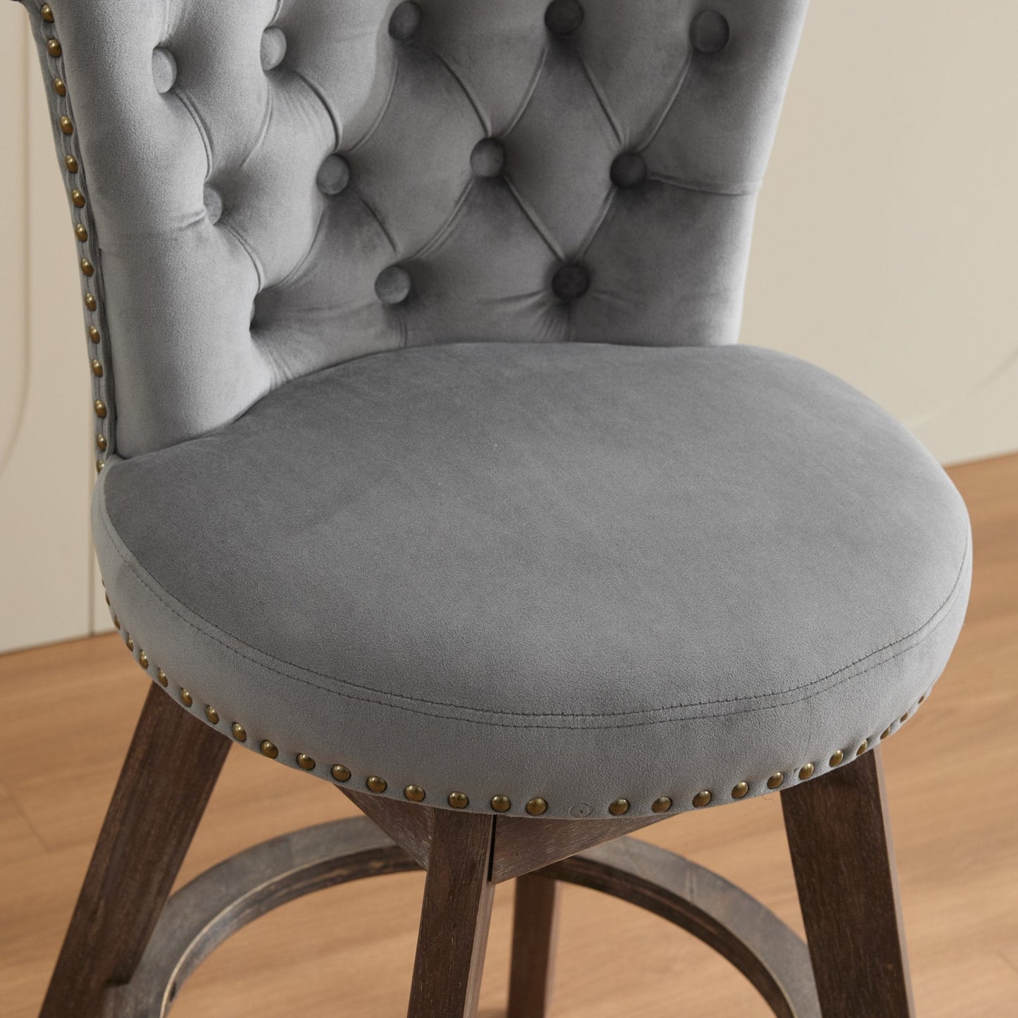 Counter-height velvet bar stool in grey with tufted back and brass nailhead trim on Tampa Home & Garden Store